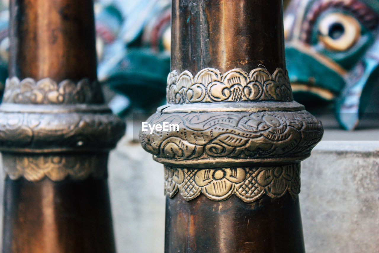Close-up of religious bowls in temple