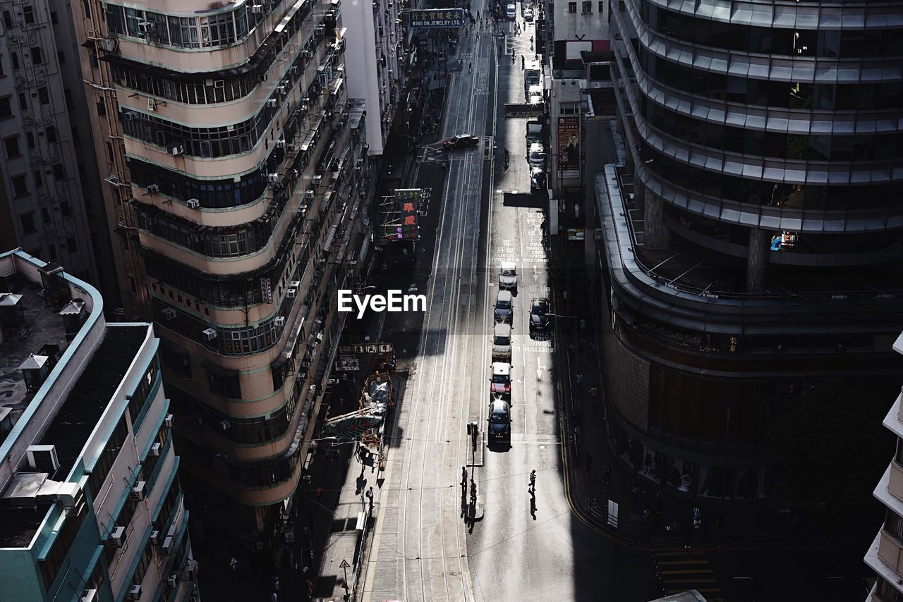 High angle view of city street by modern buildings