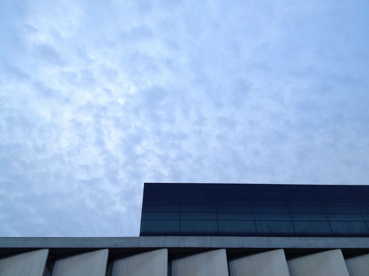 High section of building against blue sky