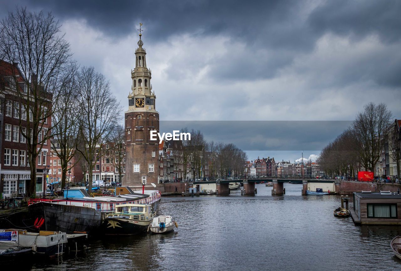 VIEW OF CANAL AMIDST BUILDINGS IN CITY