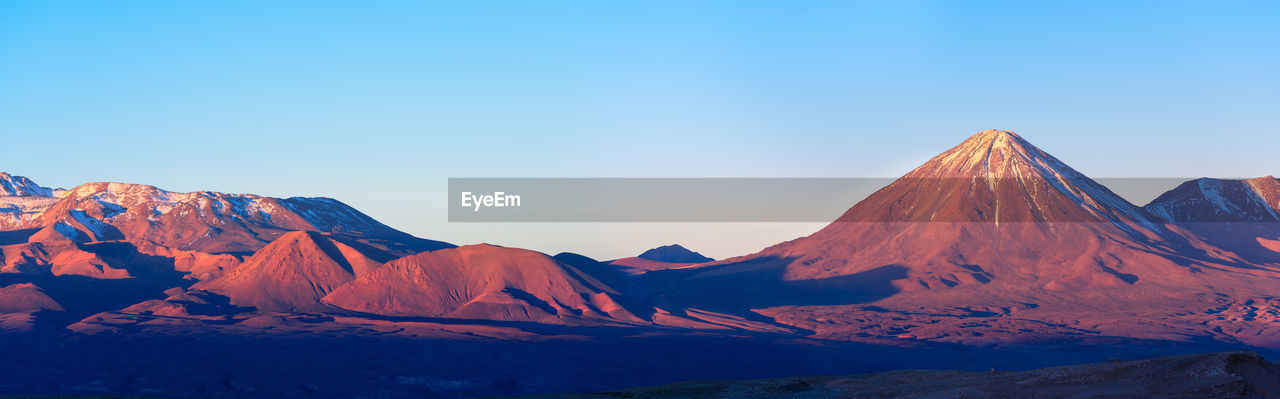 Panoramic view of licancabur volcano at sunset, san pedro de atacama, atacama desert, chile