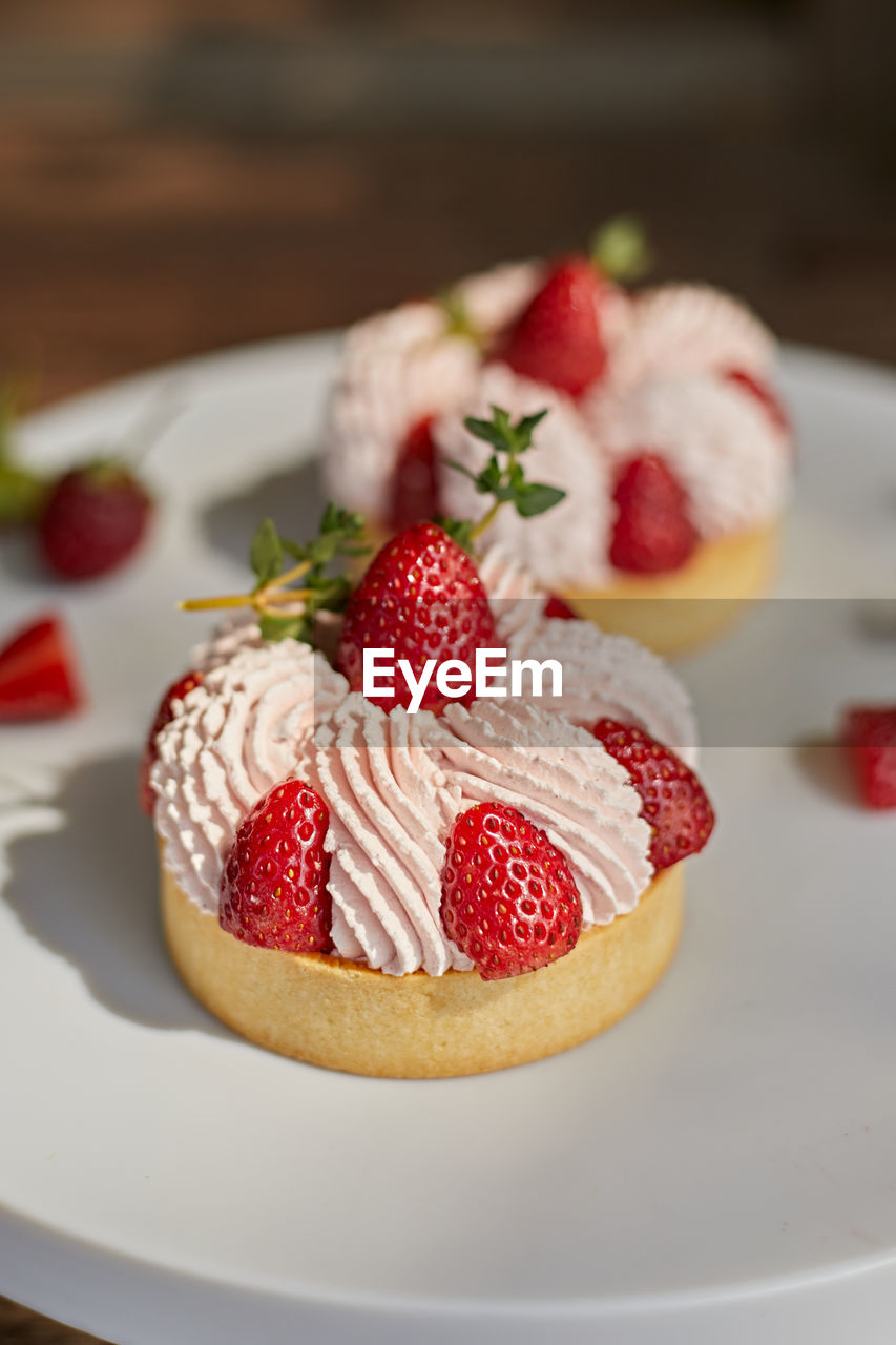 food and drink, food, fruit, strawberry, berry, healthy eating, sweet food, freshness, dessert, sweet, pavlova, breakfast, produce, cake, dish, meal, plate, baked, no people, cream, raspberry, plant, strawberry pie, indoors, birthday cake, tart, wood, red, table, close-up, sweetness, still life