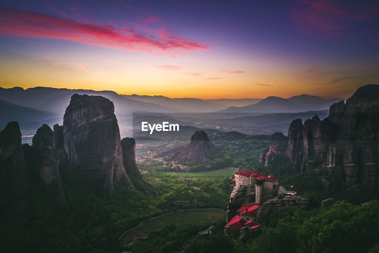 Scenic view of mountains against cloudy sky