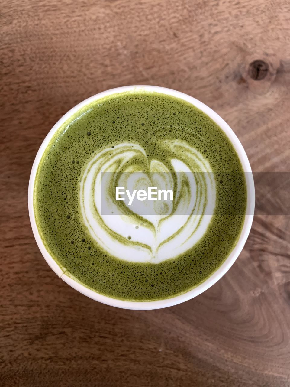 Directly above shot of matcha tea on table