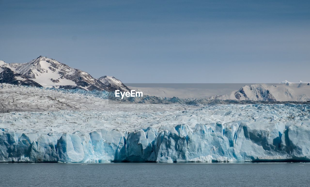 Scenic view of  a glacier against sky