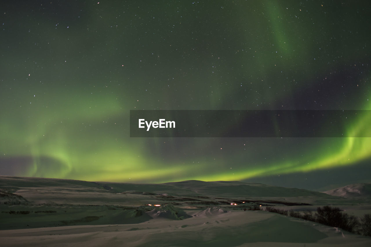 Green sky due to aurora borealis near akureyri