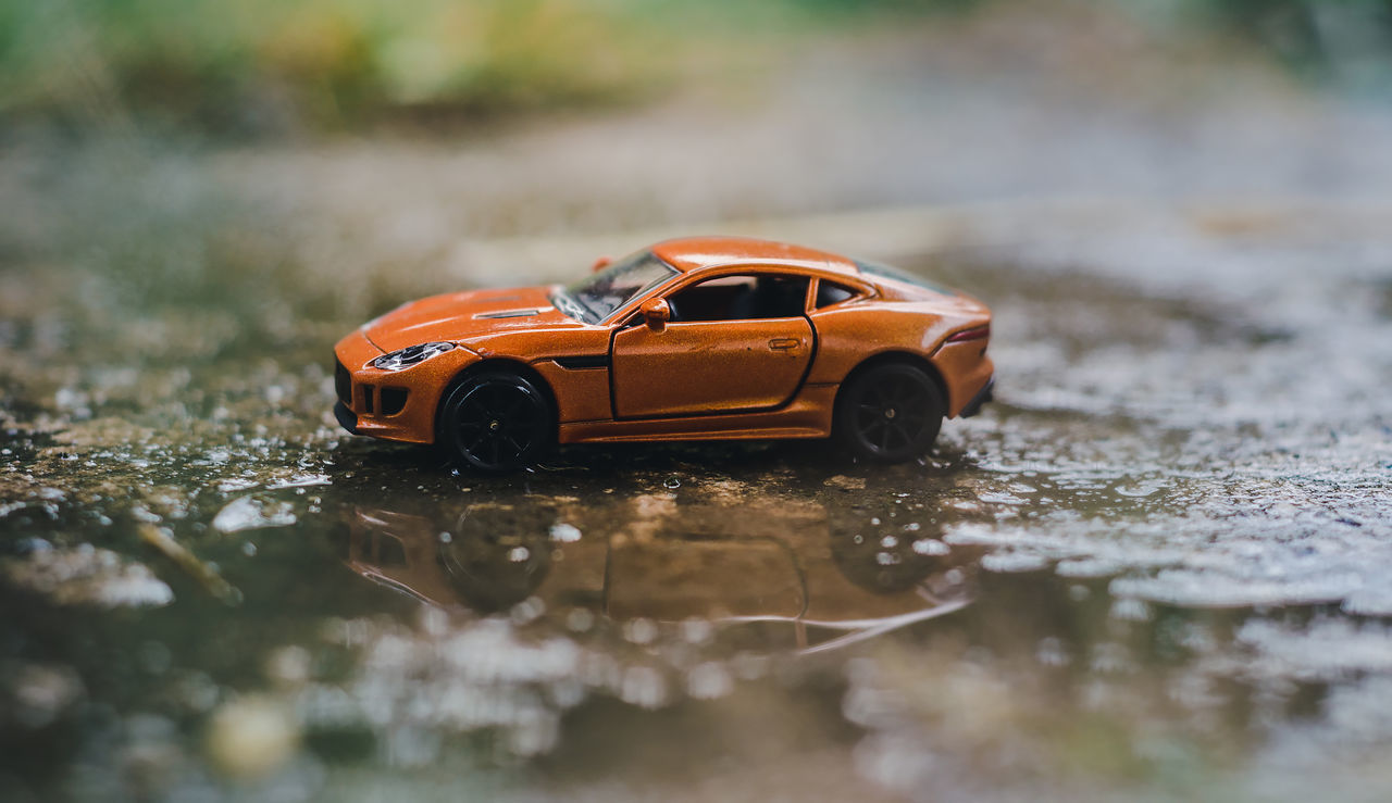 CLOSE-UP OF WET TOY CAR
