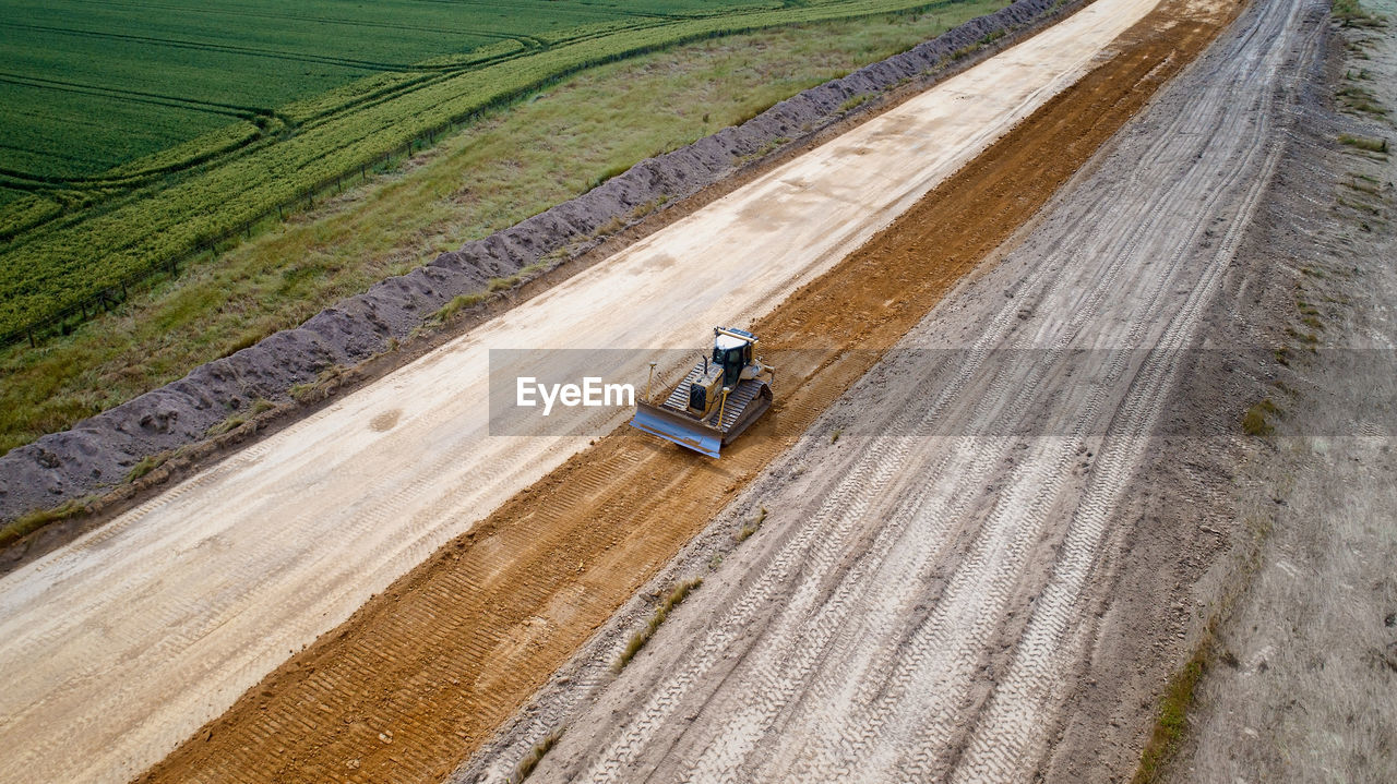 Aerial view of bulldozer on dirt road