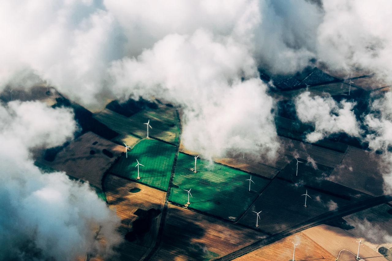 Aerial view of wind turbines on agricultural field