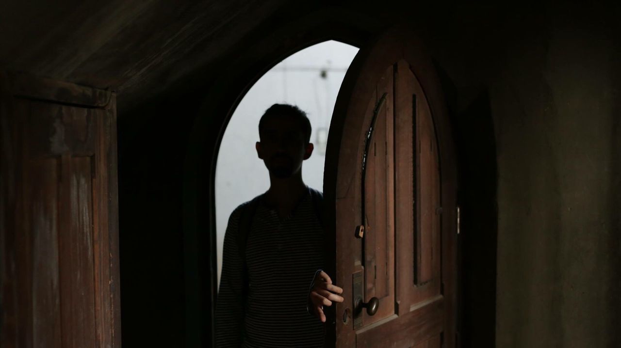 Man standing at doorway