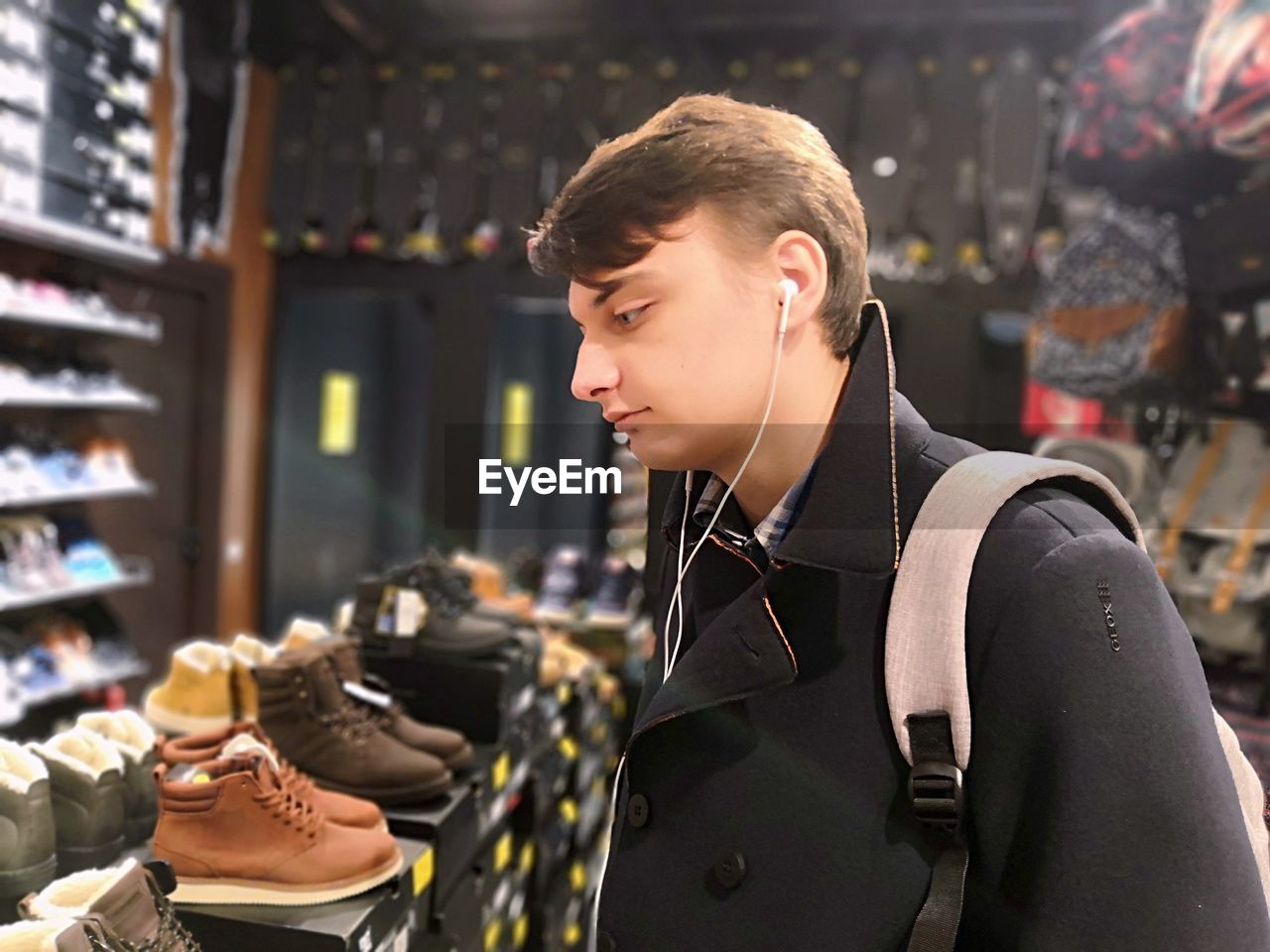 Man choosing shoes in store