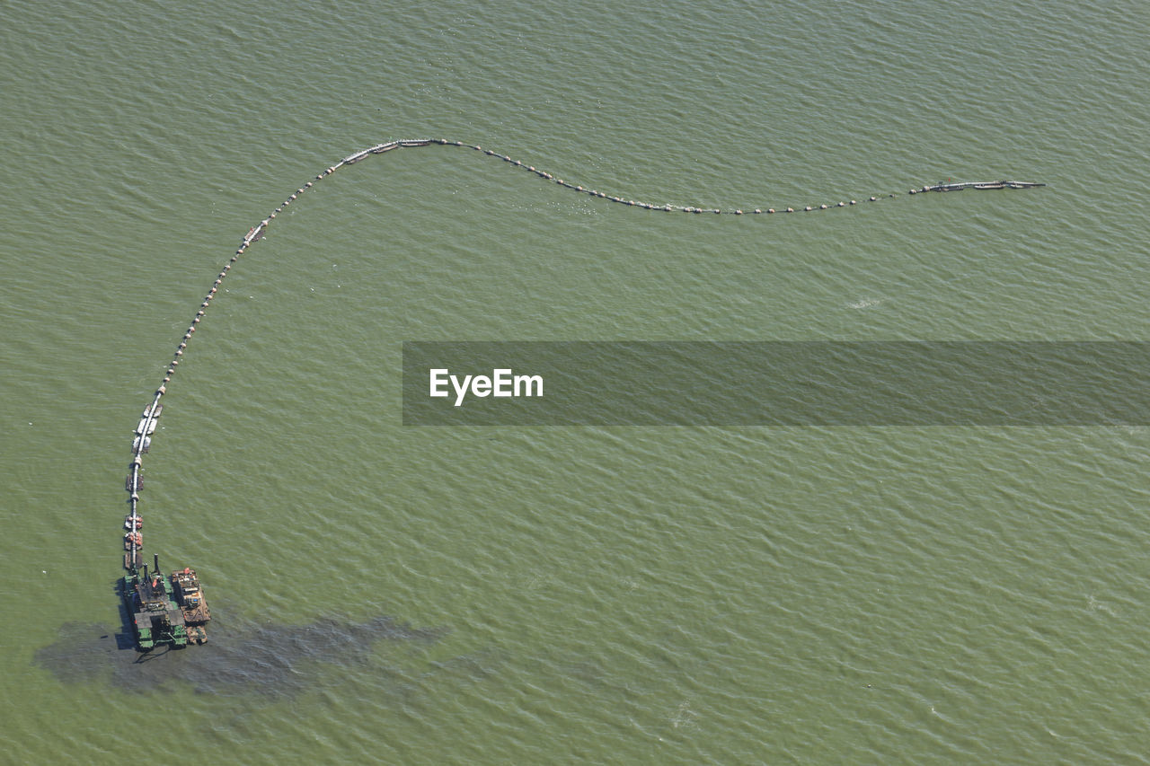 Aerial view of oil rig polluted dian lake