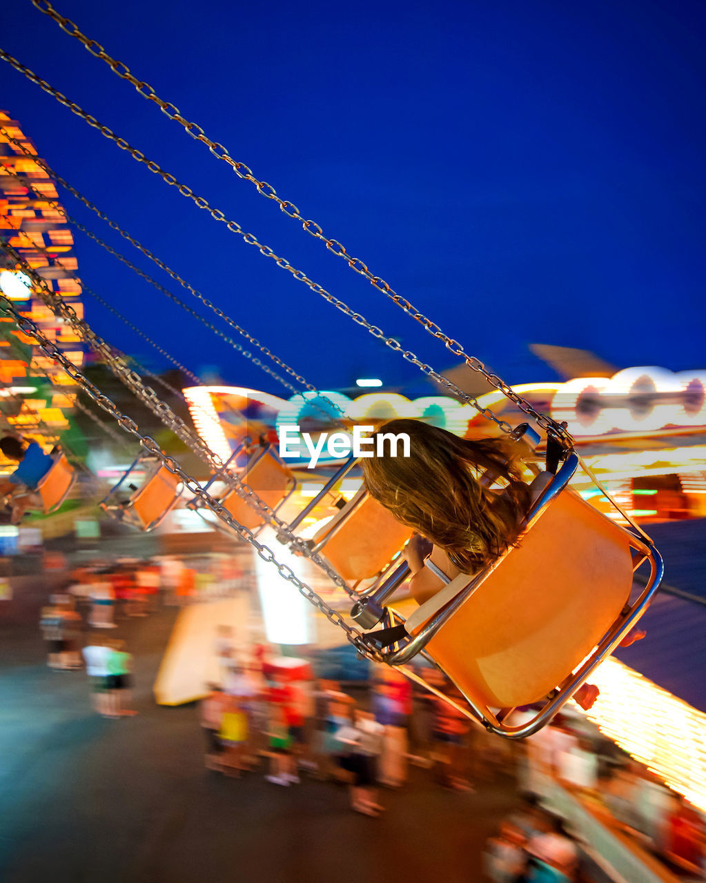 Girl Enjoying Chain Swing Ride At Night On Eyeem