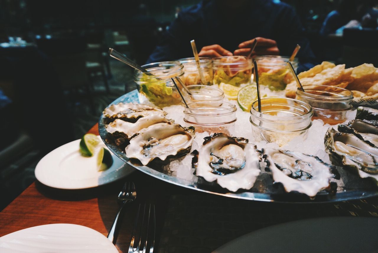 Close-up of serving oysters on plate