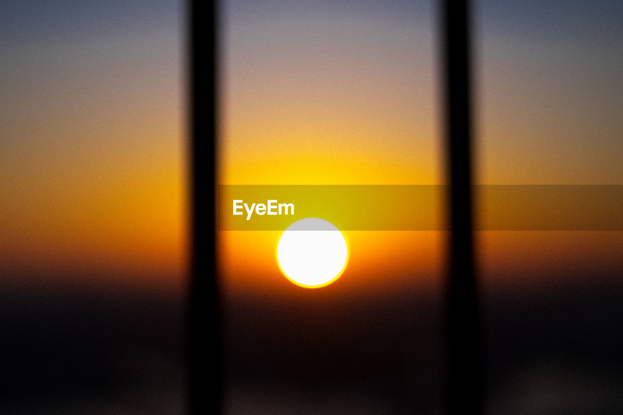 Sun shining against sky