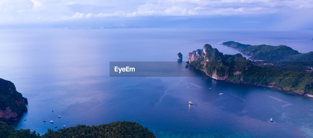 Aerial drone view of tropical ko phi phi island, and boats passenger in blue clear andaman sea 