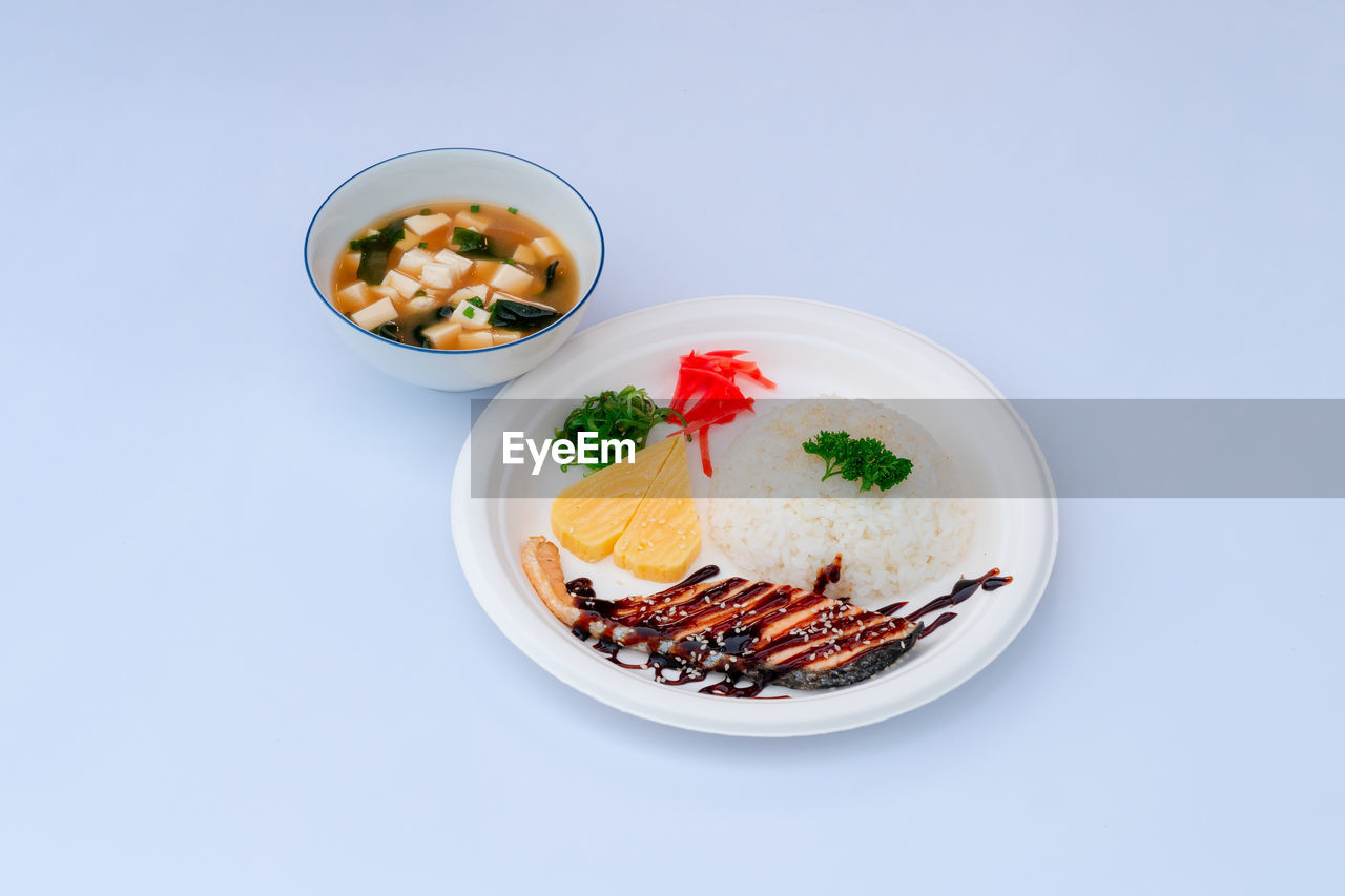 high angle view of food in plate on white background