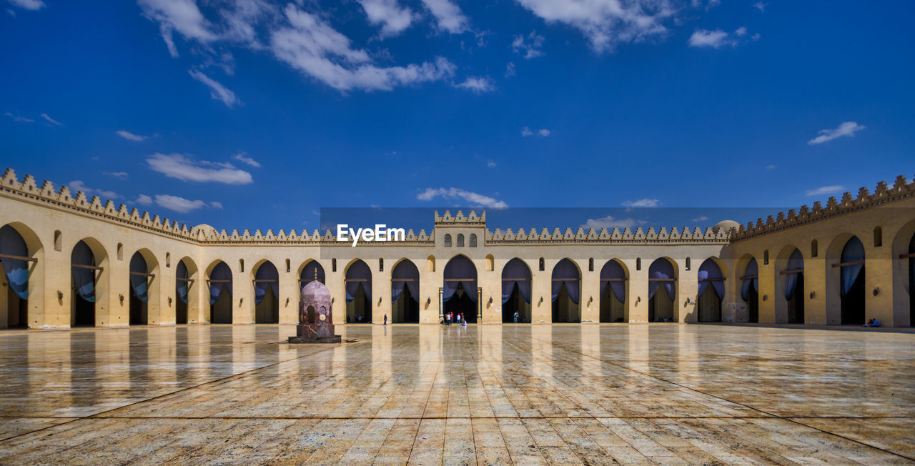 Panoramic view of al-hakim mosque against blue sky