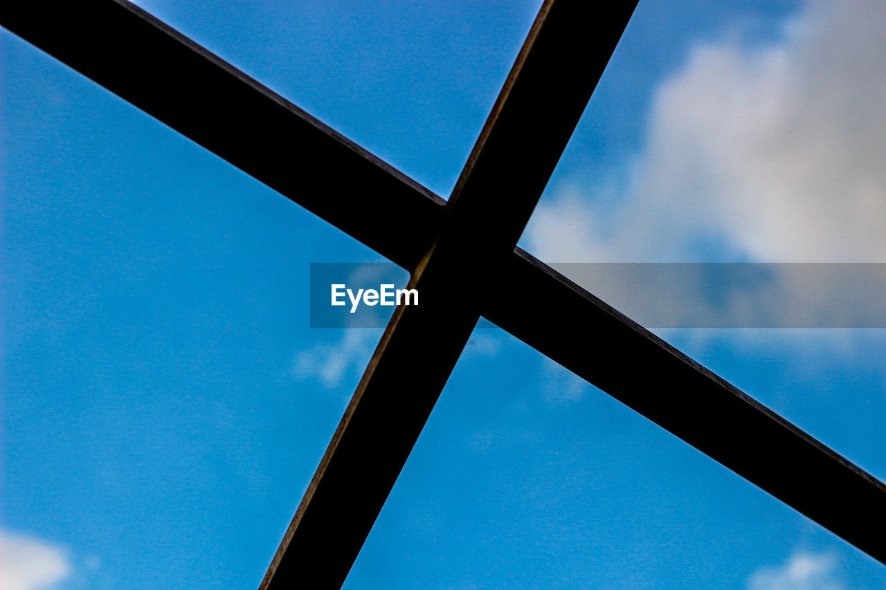 LOW ANGLE VIEW OF SKY SEEN THROUGH METAL WINDOW