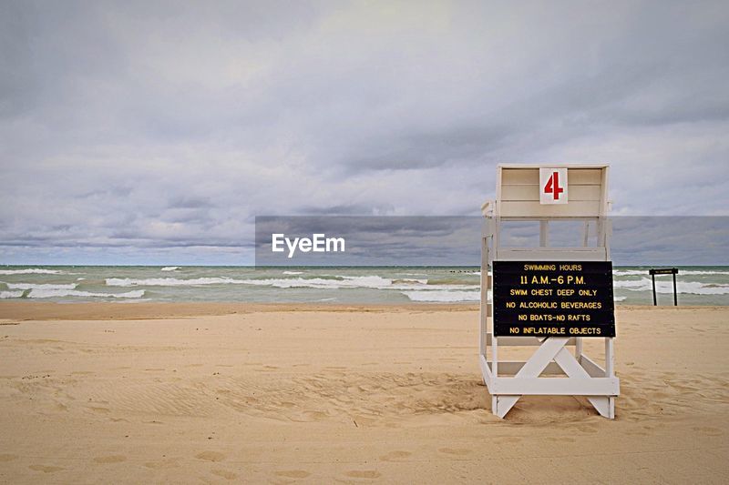 Text On Empty Lifeguard Chair At Sandy Beach Id 91873254