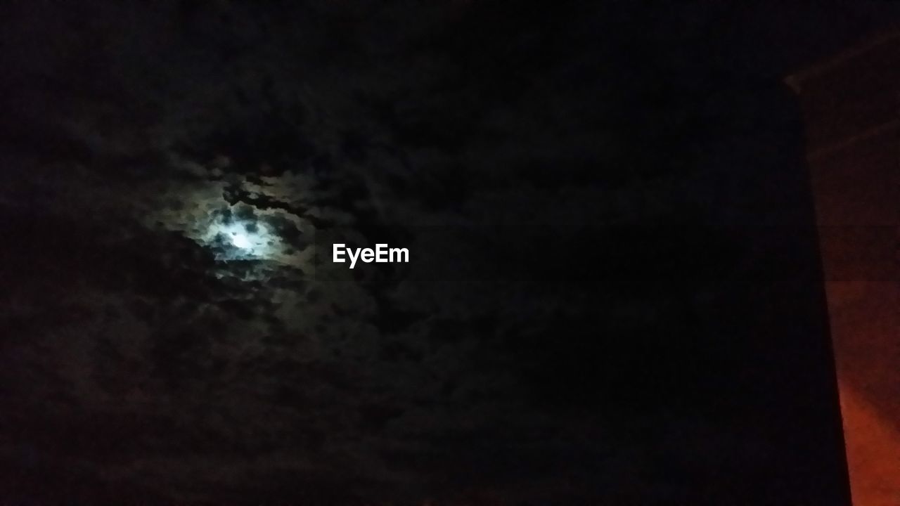 LOW ANGLE VIEW OF MOON AT NIGHT