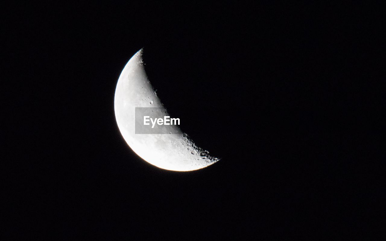 LOW ANGLE VIEW OF HALF MOON AGAINST SKY