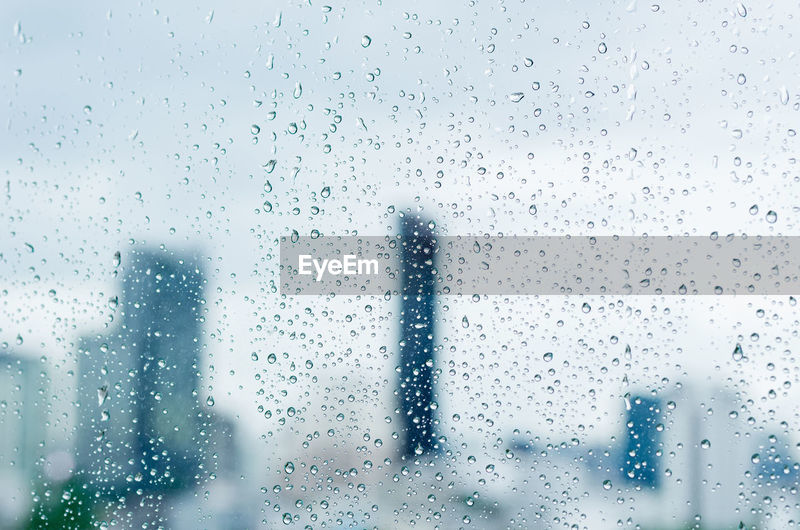 Rain drop on glass window at day time in | ID: 181323975