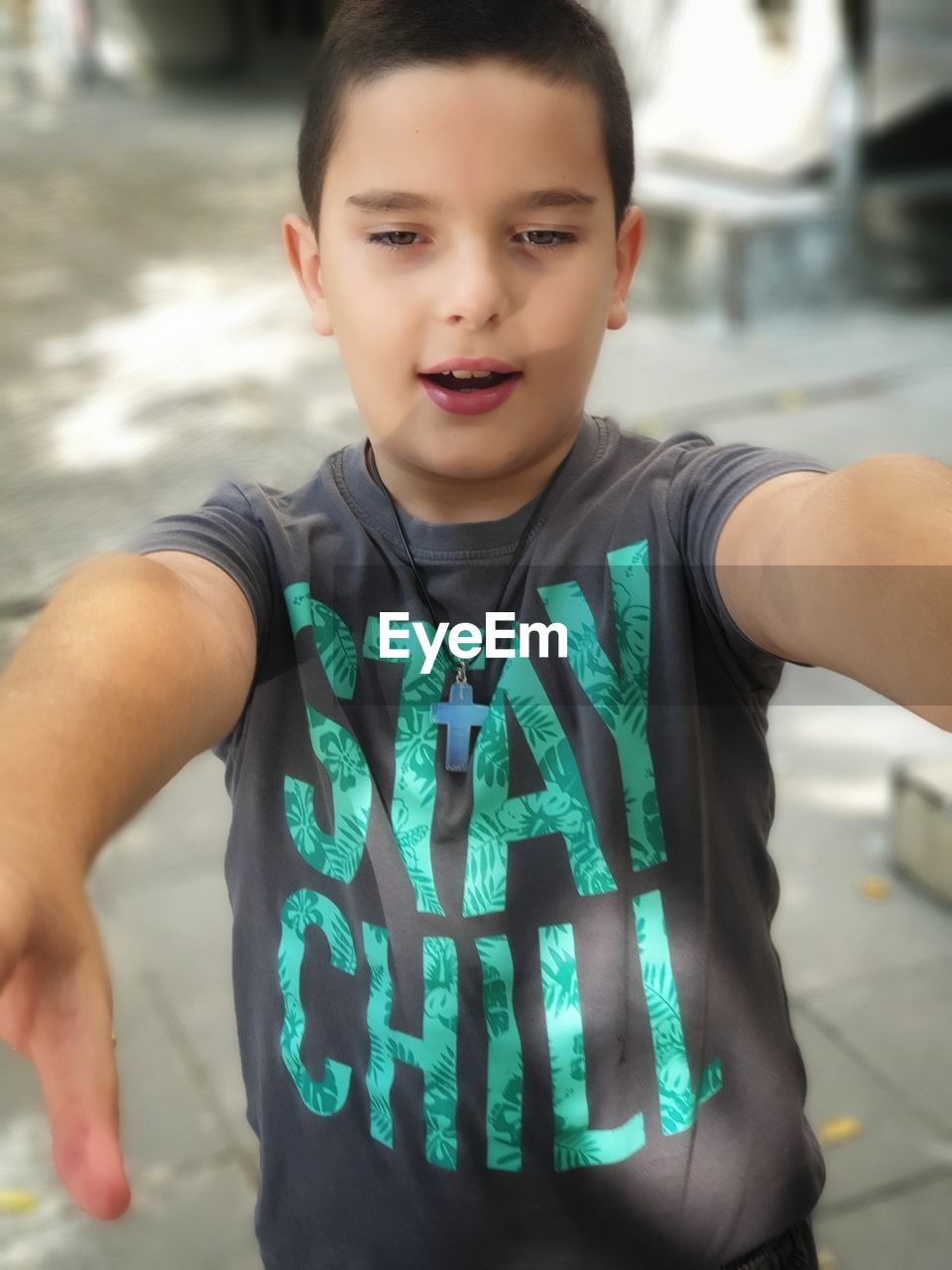 Portrait of boy standing outdoors