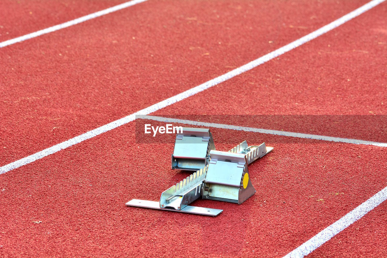 High angle view of starting block on running track