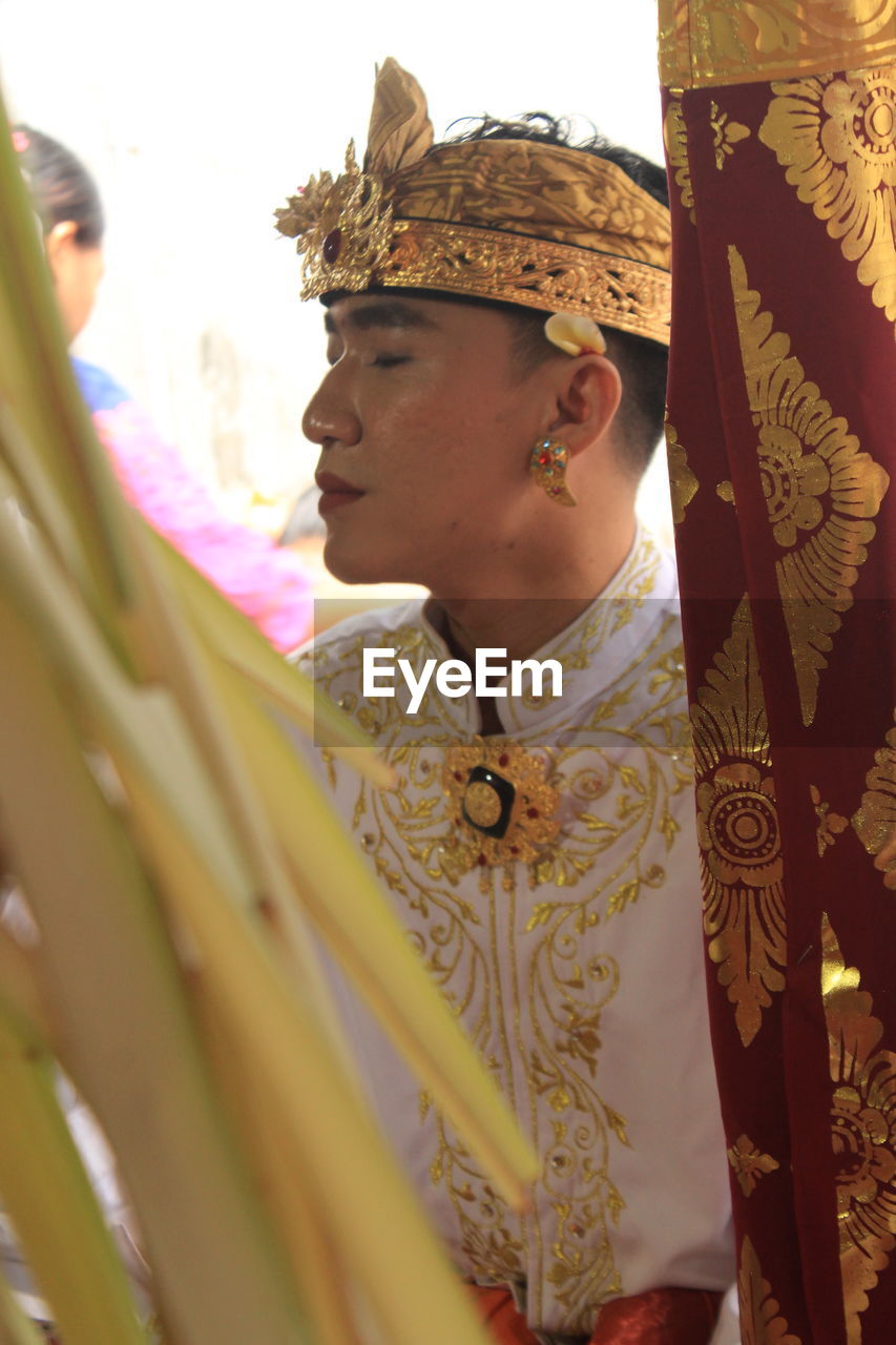 Youth wearing traditional balinese clothes modified during traditional ceremonies