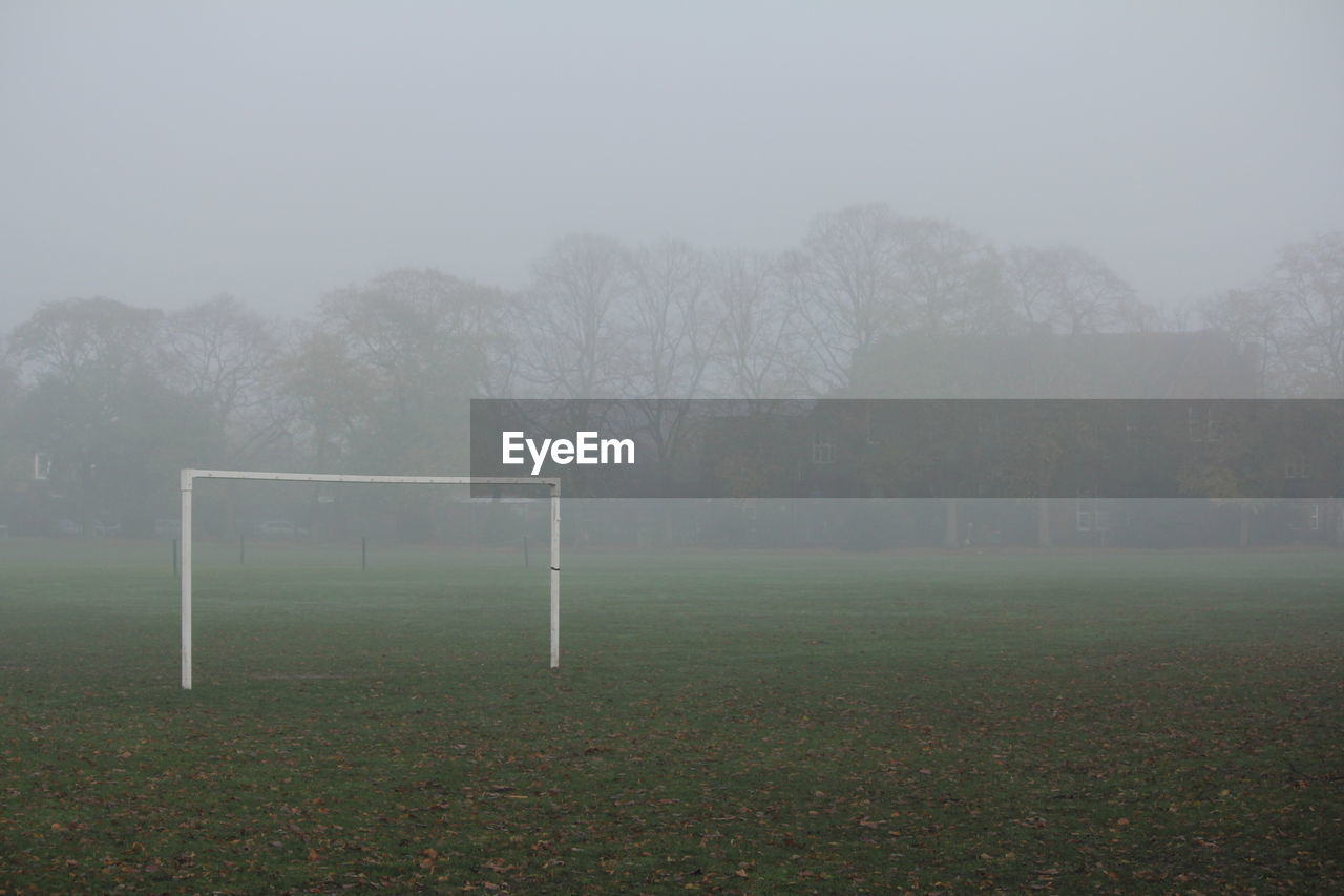 Goal post on playground in foggy weather