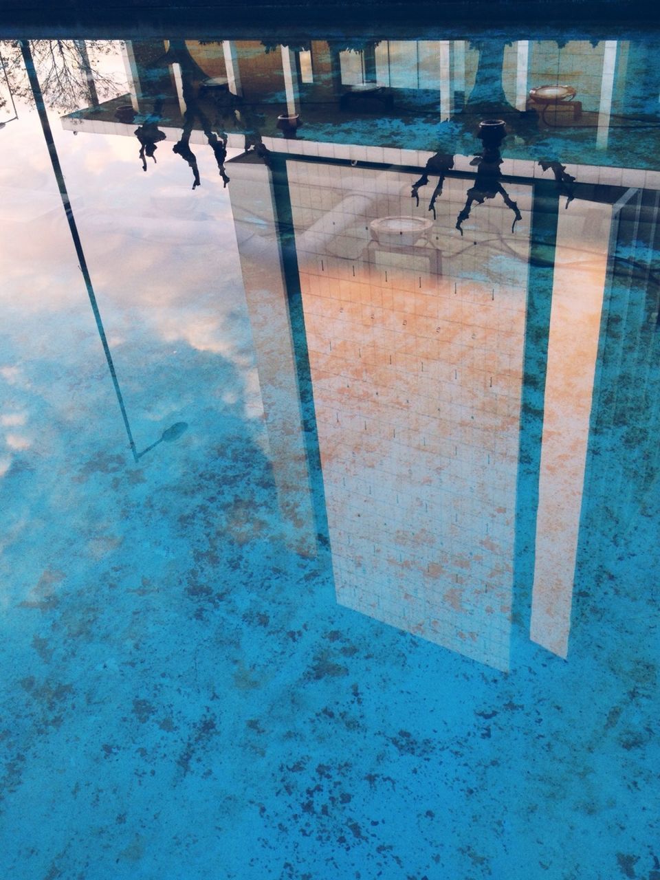 Reflection of building in swimming pool