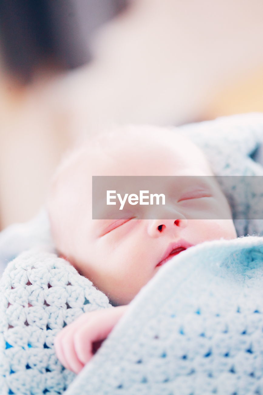 Close Up Of Baby In Blanket ID 100285974