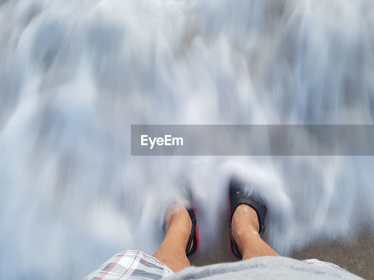 Low section of person in sea