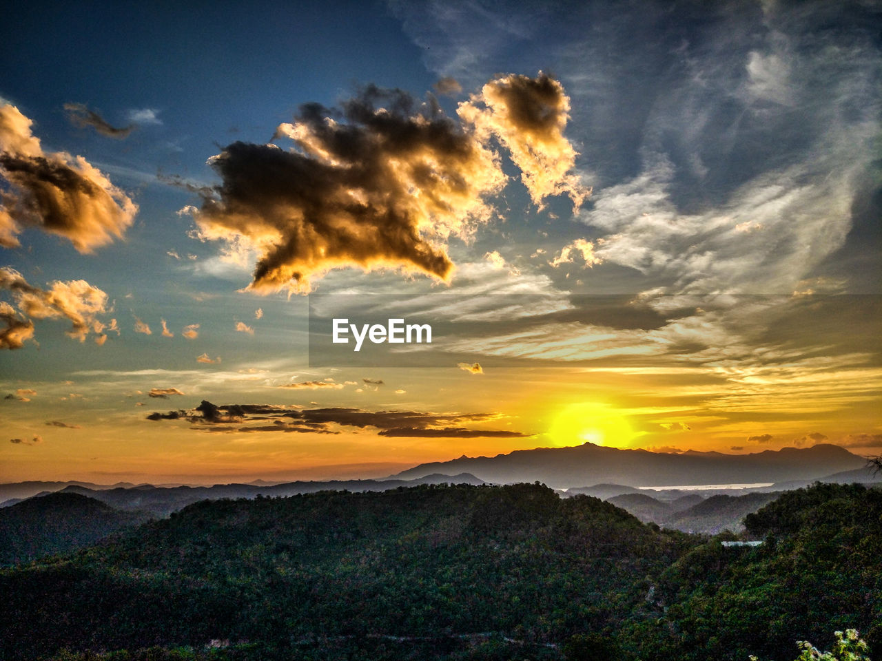 Scenic view of landscape against sky during sunset