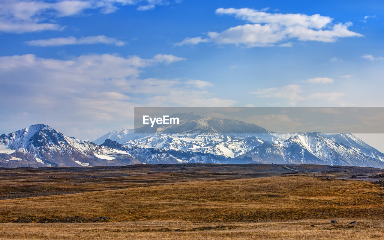 VIEW OF SNOWCAPPED MOUNTAINS AGAINST SKY