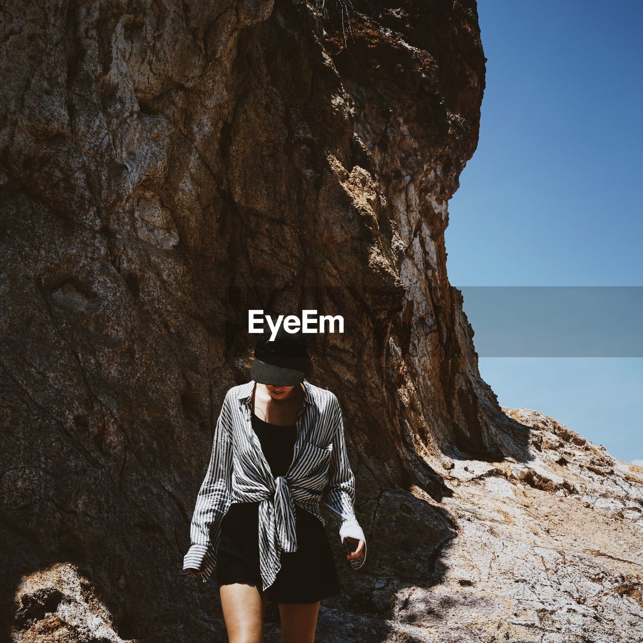 Woman walking on rock formation