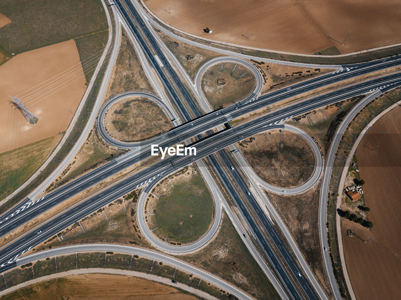 HIGH ANGLE VIEW OF ELEVATED ROAD BY HIGHWAY