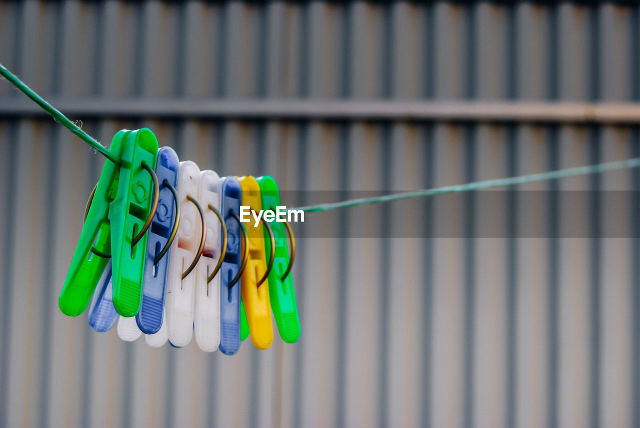 CLOSE-UP OF CLOTHES HANGING ON CLOTHESLINE