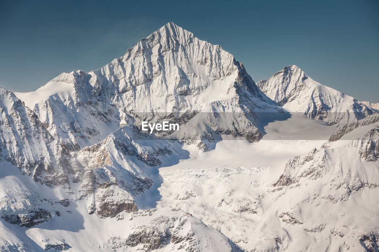 Scenic view of snowcapped mountains against sky. view from klein matterhorn, swiss alps