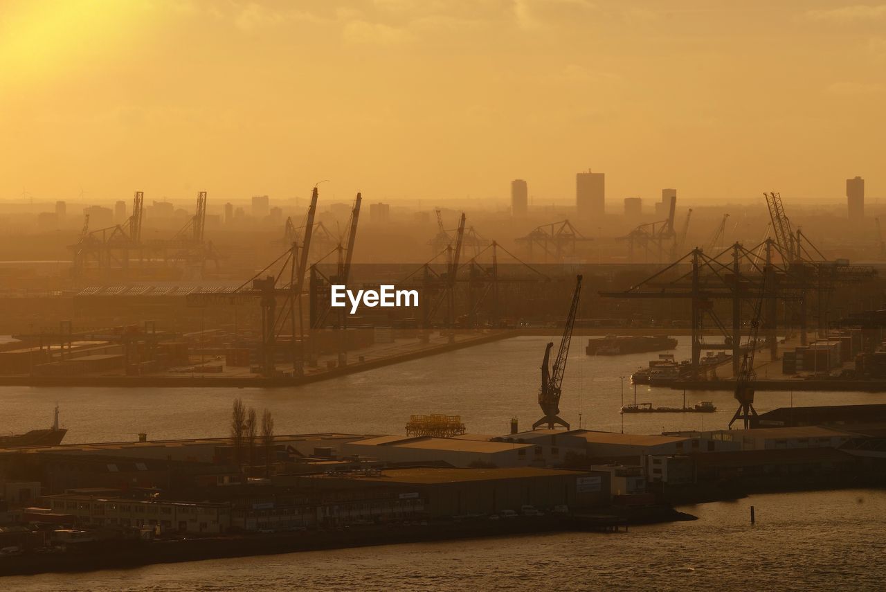 Smoggy skyline of rotterdam industry harbour