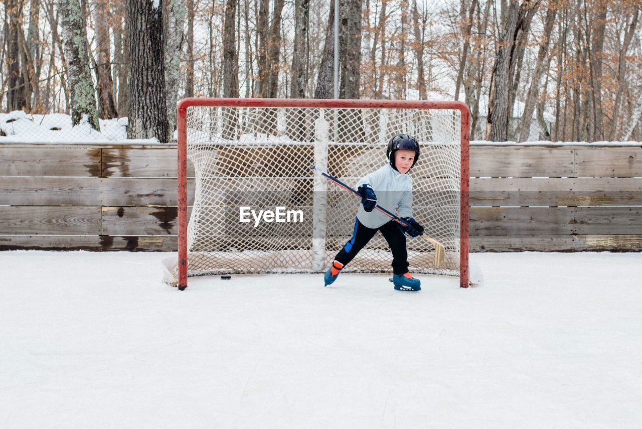 Portrait of boy playing ice hockey