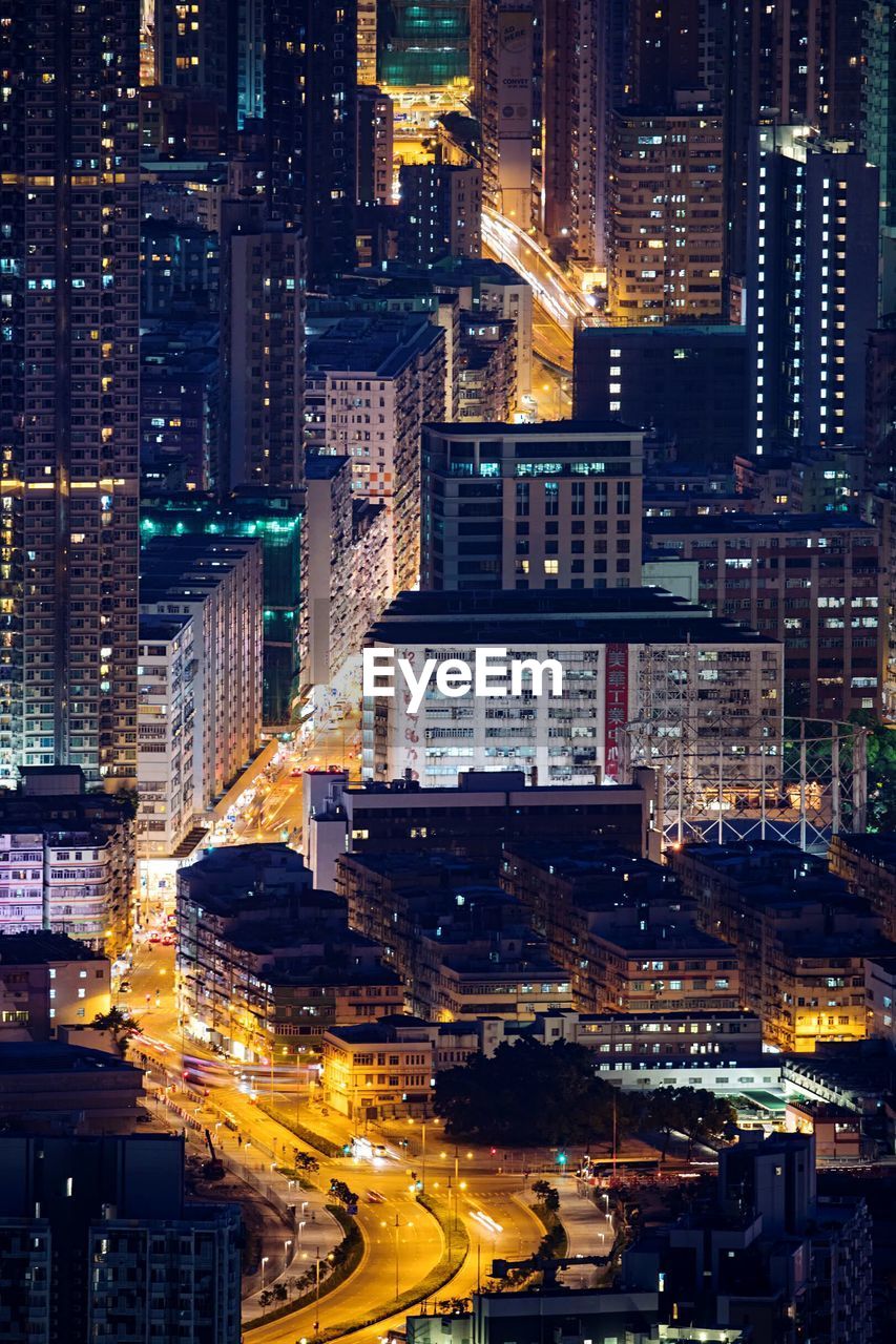 High angle view of illuminated buildings in city at night