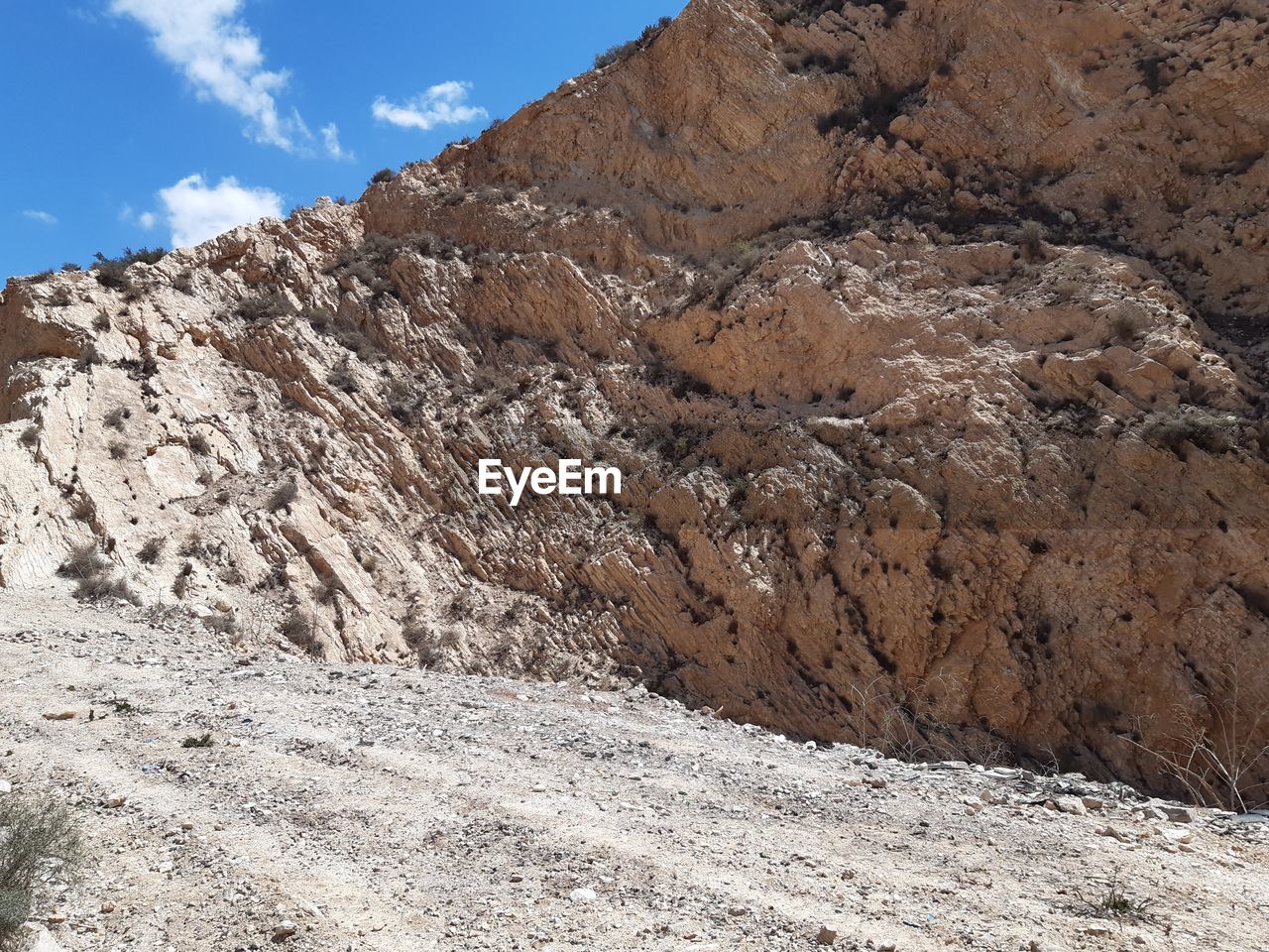 Low angle view of rock formation against sky