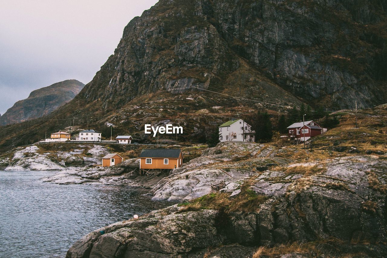 Houses on mountain by sea