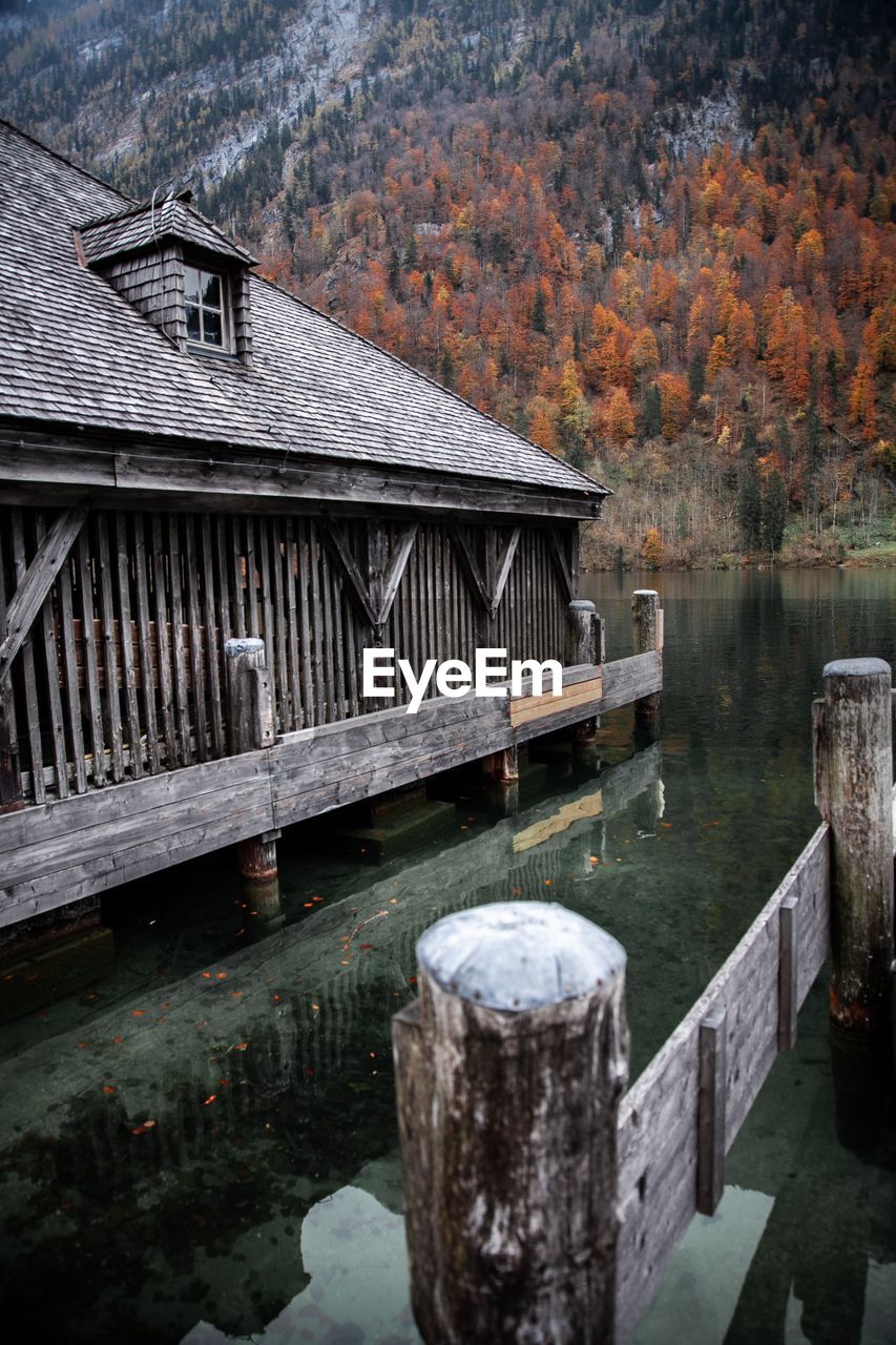 Wooden bridge over lake during autumn