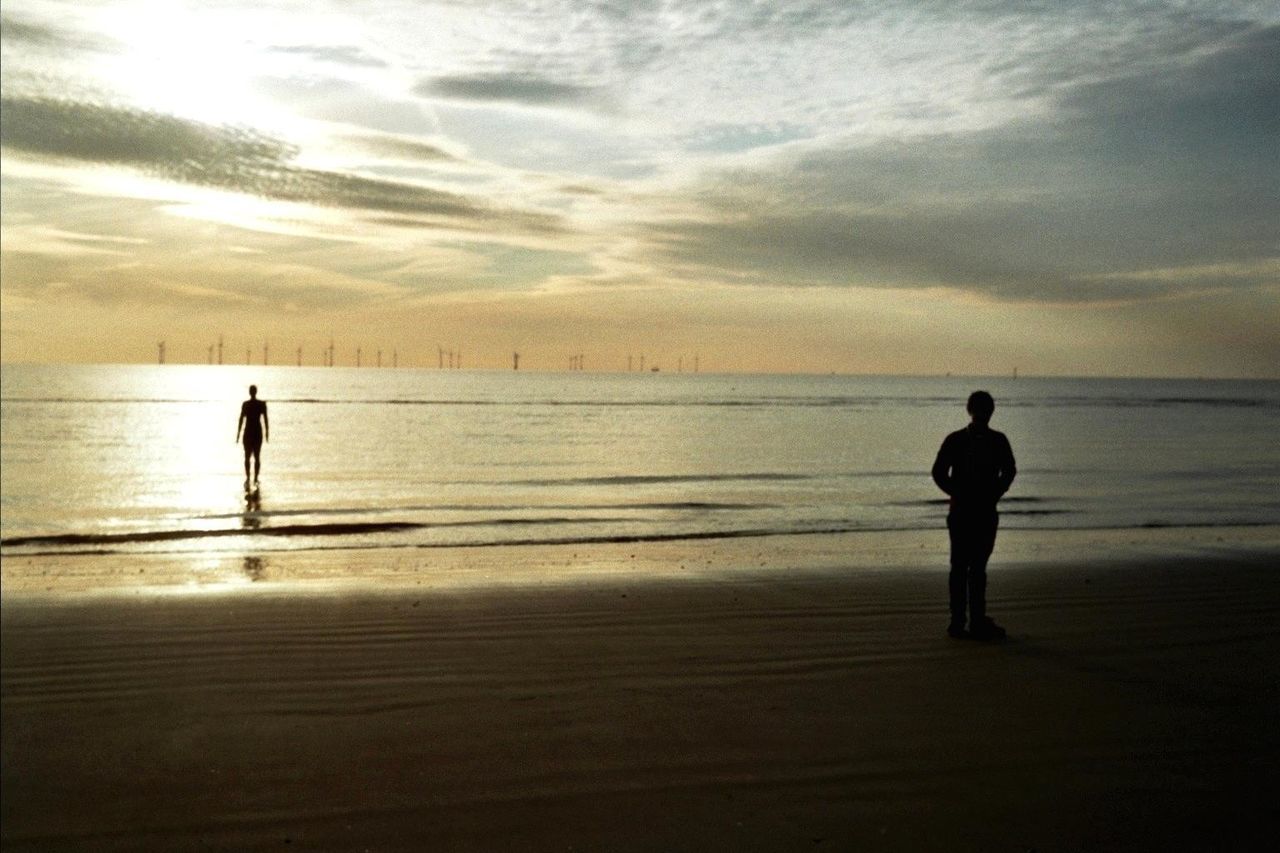 SILHOUETTE OF PEOPLE ON BEACH