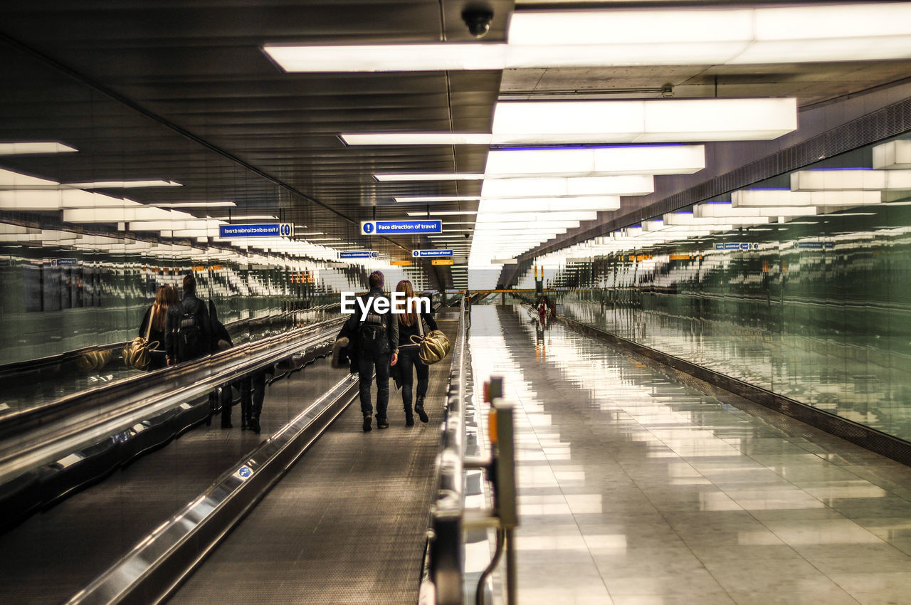 Rear view of people at airport