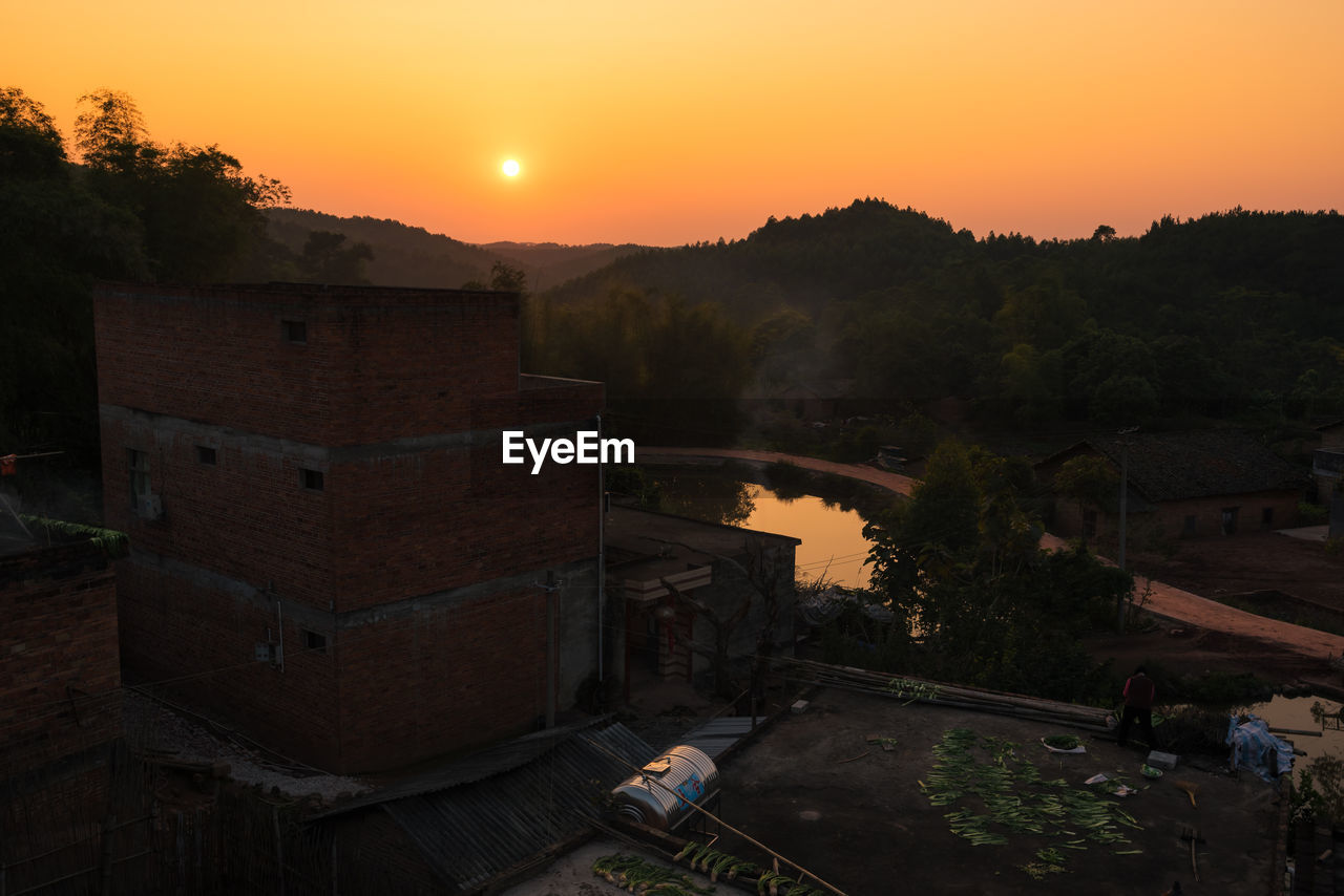 Scenic view of village at sunset