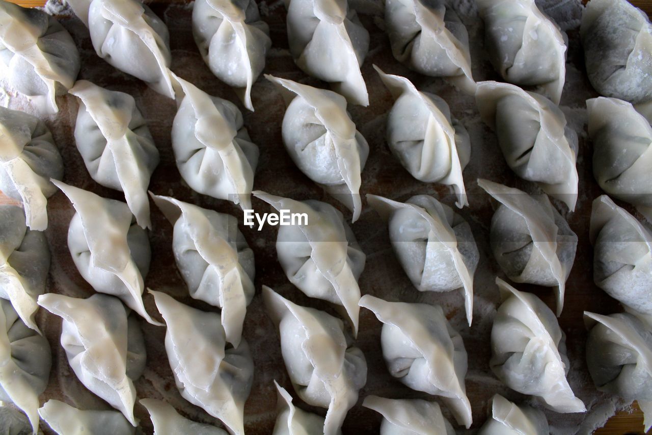 High angle view of chinese dumplings on cutting board